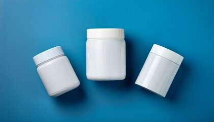 Three White Containers On Blue Surface