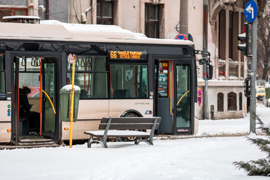 Morning commute with public transport STB vehicle on snowy roads in Bucharest Romania