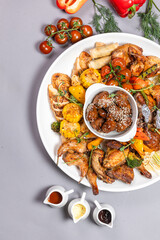Grilled Chicken Sharing Platter with Veggies, Sesame Mushrooms and Sauces Top View