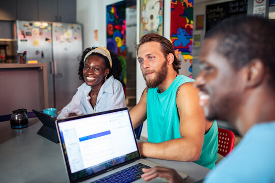 Diverse young adults collaborating in a casual coworking space