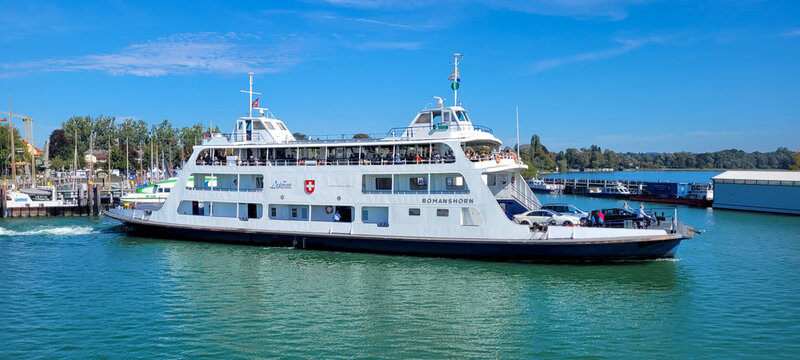 Friedrichshafen, Germany - September 23, 2023. A Swiss ferry MF Romanshorn leaves the port of Friedrichshafen in Germany at the lake Constance and heads to the Romanshorn in Switzerland.