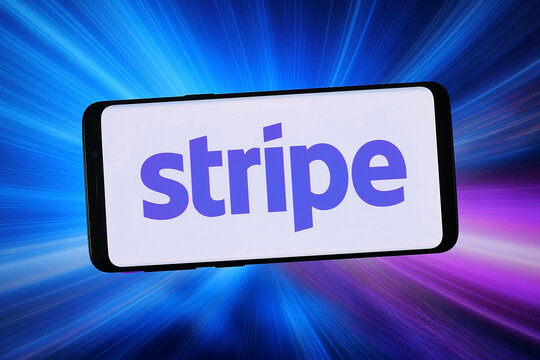 Stuttgart, Germany - 02-04-2026: In this photo illustration, the logo of financial services company Stripe Inc. is displayed on a smartphone in front of abstract background on computer screen.