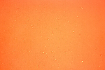 Peach color background with water drops, coral background 