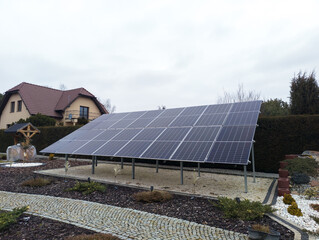 Ground mounted solar panels on landscaped residential land © Fotolixir