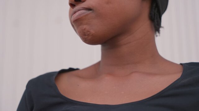 Intense emotional expression. Focused woman practicing serious lines. Black woman preparing with calm determination and focus. Closeup of poised woman rehearsing with quiet strength and concentration