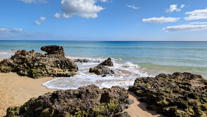 Rocky coast with blue waters of the Atlantic Ocean, Fuerteventura, Canary Islands, Spain.  © Inha