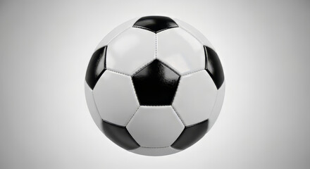 Naklejka premium A classic black and white soccer ball, showcasing its iconic pentagonal and hexagonal pattern against a simple gradient background.