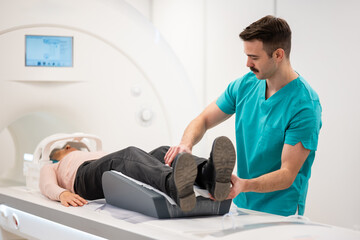 Medical professional preparing patient for mri scan
