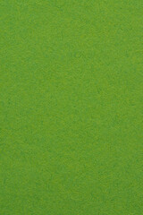 Green paper texture background with natural fibrous surface