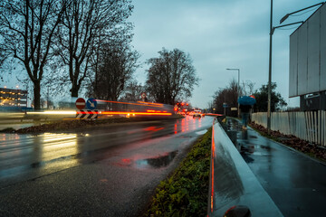 Rainy Commute Illuminated: Stunning Light Trails Capture Urban Motion