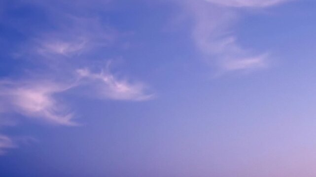 Soft pastel twilight sky with wispy cirrus clouds, calm minimalist background for wellness and meditation themes, serene evening atmosphere for summer solstice