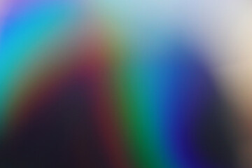 Fototapeta premium Soft focus rainbow neon noise grain blur texture prism refraction. Light and shadow smoke abstract gradient reflaction rays background. wall