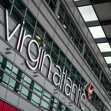 LONDON, UK - NOVEMBER 15, 2019:  Virgin Atlantic Sign on side of Terminal Three (3) building at Heathrow Airport, Hounslow