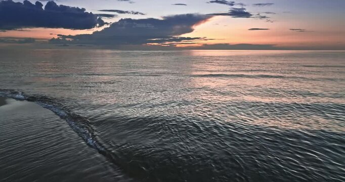 Calm golden sunset over Batlic sea in summer.