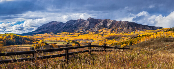 Wooden Fence, Golden Aspens and Mountain Peaks