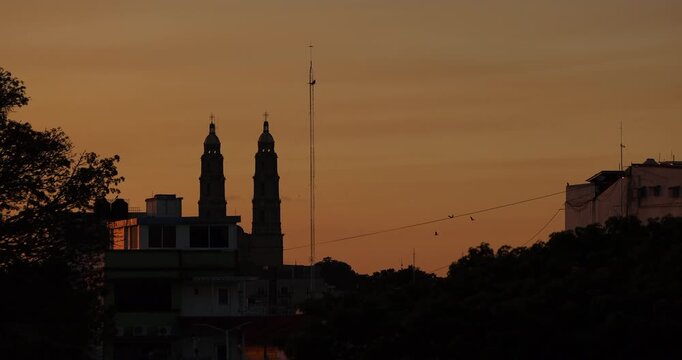 Sunset view of a church spire in downtown Villahermosa, Tabasco, Mexico.