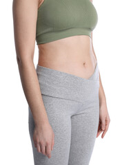 Woman in sportswear after weight loss on white background, closeup