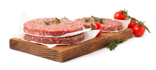 Uncooked meat patty with thyme and tomatoes isolated on white