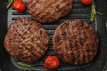 Fotobehang Eten Delicious grilled meat patties, tomatoes and rosemary in grill pan, flat lay  © New Africa
