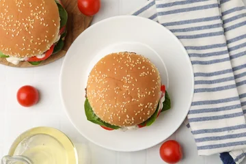 Fotobehang Eten Delicious burgers with meat patties on white table, flat lay  © New Africa