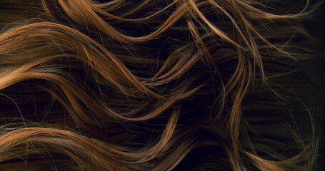 Naklejka premium Close-up abstract texture of flowing brown hair forming elegant natural waves and curves. Organic motion, soft light and rich tones create a cinematic beauty background or luxury visual element.