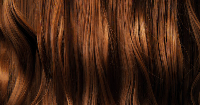 Close-up abstract texture of flowing brown hair forming elegant natural waves and curves. Organic motion, soft light and rich tones create a cinematic beauty background or luxury visual element.