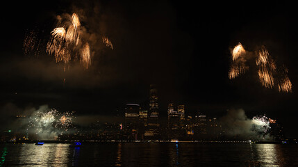 Fototapeta premium New York Manhattan fireworks. New York Fireworks over Manhattan. New York City 4th of July Fireworks. New York City Skyline Manhattan with Flashing Fireworks. Independence day.