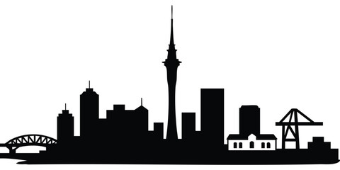 Fototapeta premium Auckland Skyline Silhouette. A black silhouette of a city skyline featuring a tall central tower resembling the Sky Tower, a bridge structure on the left, and an industrial crane on the right. 