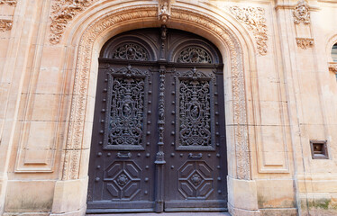 Old French house with traditional doubler doors, Metz, France.