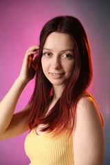Fototapeta premium Woman with dyed hair on color gradient background