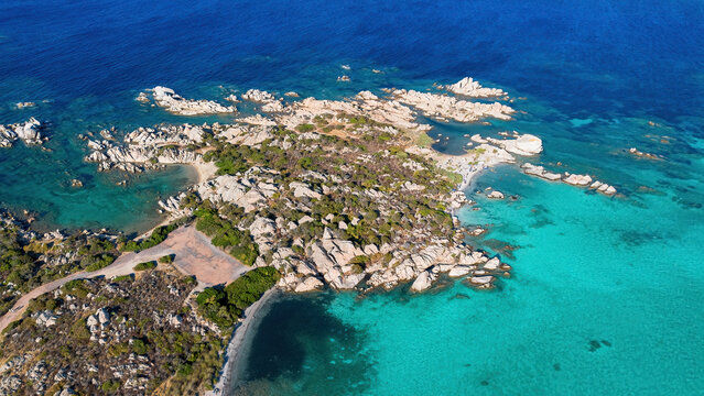 Aerial view of Capocchia d'u purpu beach (Testa del Polpo) and its iconic granite rock on Giardinelli island in La Maddalena archipelago, Sardinia, Italy
