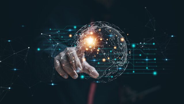 Global digital network technology concept. Human hand Pointing at a glowing data network globe. Artificial intelligence, innovation, connectivity, cybersecurity and future business transformation.