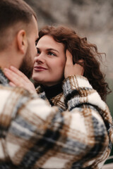 Fototapeta premium Couple shares a tender moment in a natural setting on Valentines Day celebrating their love and connection in a romantic atmosphere