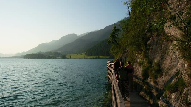 Beautiful landscape of Wolfgangsee Austria. Waves crashing against the shore in the landscape of the Alpine mountains.