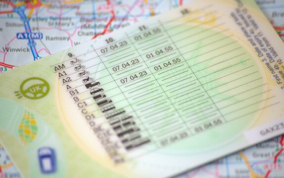 Back of provisional licence on British map. Macro image.