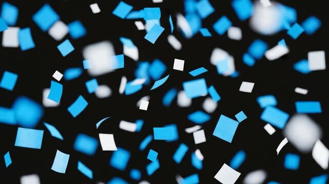 Celebratory Confetti: A mesmerizing visual of blue and white confetti squares floating in mid-air, creating a vibrant display of joy and celebration.