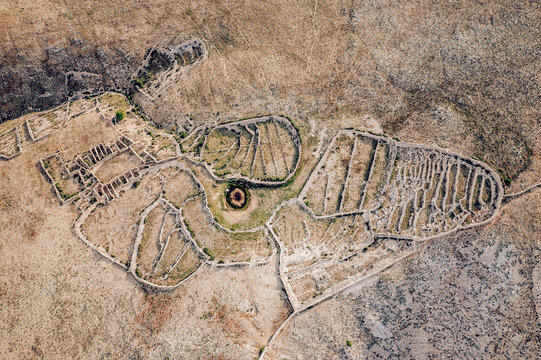 Aerial view of the ancient Mirine Fulfinum ruins, a mesmerizing tapestry of stone walls and circular structures against the arid landscape, Baska, Primorje-Gorski Kotar County, Croatia.