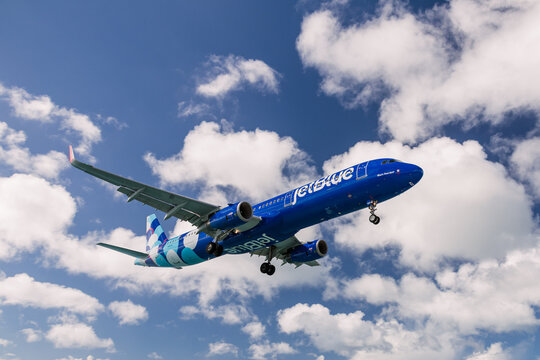 ST MARTIN, ANTILLES &ndash; JAN 23, 2026: Close view of Jet Blue airlines passenger airplane approaching for landing against a bright sky