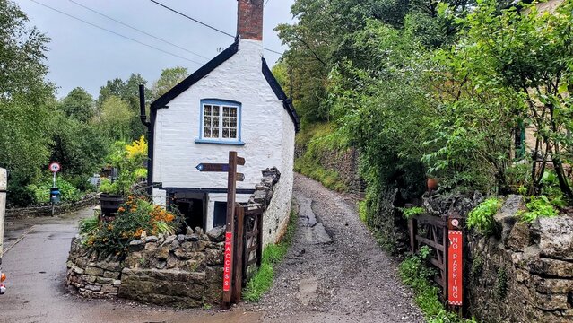 English home on a hill, split road