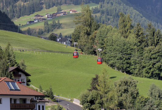 cable car view at seceda mountain italy south tirol dolomite dolomites (travel tourism hike ski lift) view forest italy alps alpine region scenic