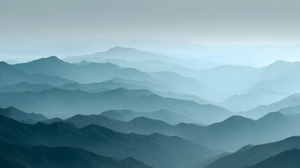 Serene Mountain Range - A Tranquil Landscape of Blue Hues and Misty Vistas.