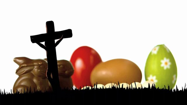 Black grass cross wood cubes entering right forming EASTER sliding showing chocolate bunny 3 eggs