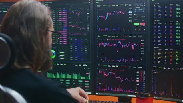 Trader Analyzing Cryptocurrency Charts on Multiple Monitors
