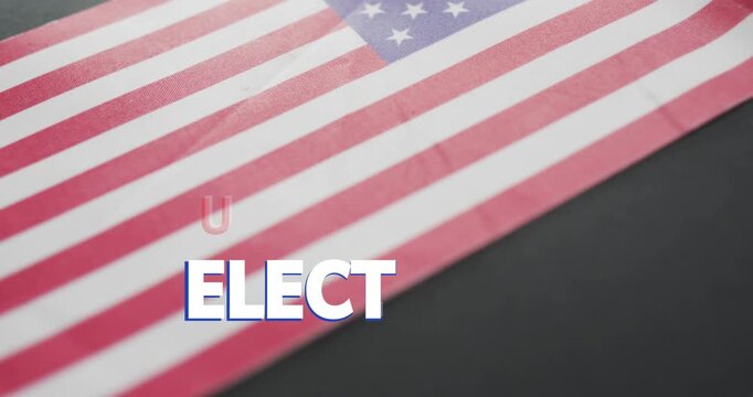 Close-up opening folded US flag, USA title scaling, shifting, letter A moving, emphasizing election