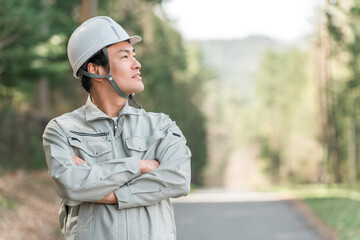 Men in work clothes working in forestry, environmental protection, and construction sites