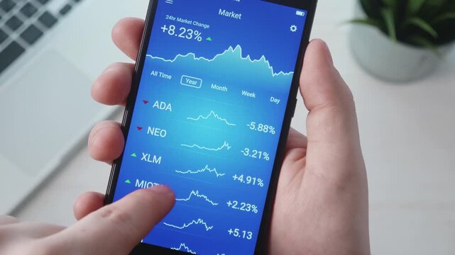 Person using cryptocurrency trading app on smartphone