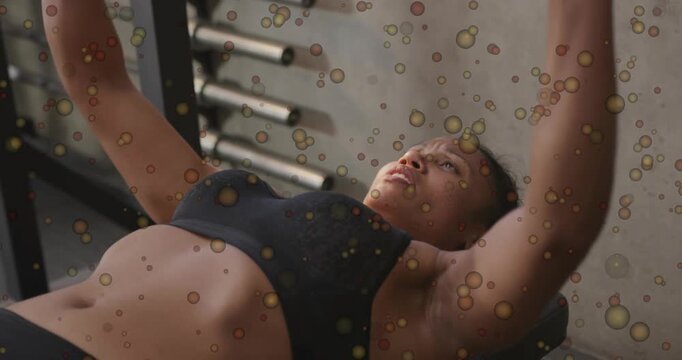 Woman gripping barbell, inhaling, bench-pressing at gym, building strength, overlay obscuring view