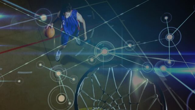 Basketball player dribbling line, driving paint, shooting layup to score, nodes over rim and player