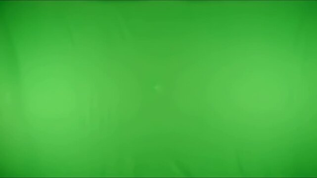 Finger Pushing into Green Screen Fabric Creating Indentation