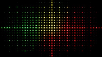 Abstract digital art of a vibrant light display with green, yellow, and red dots on a black background.